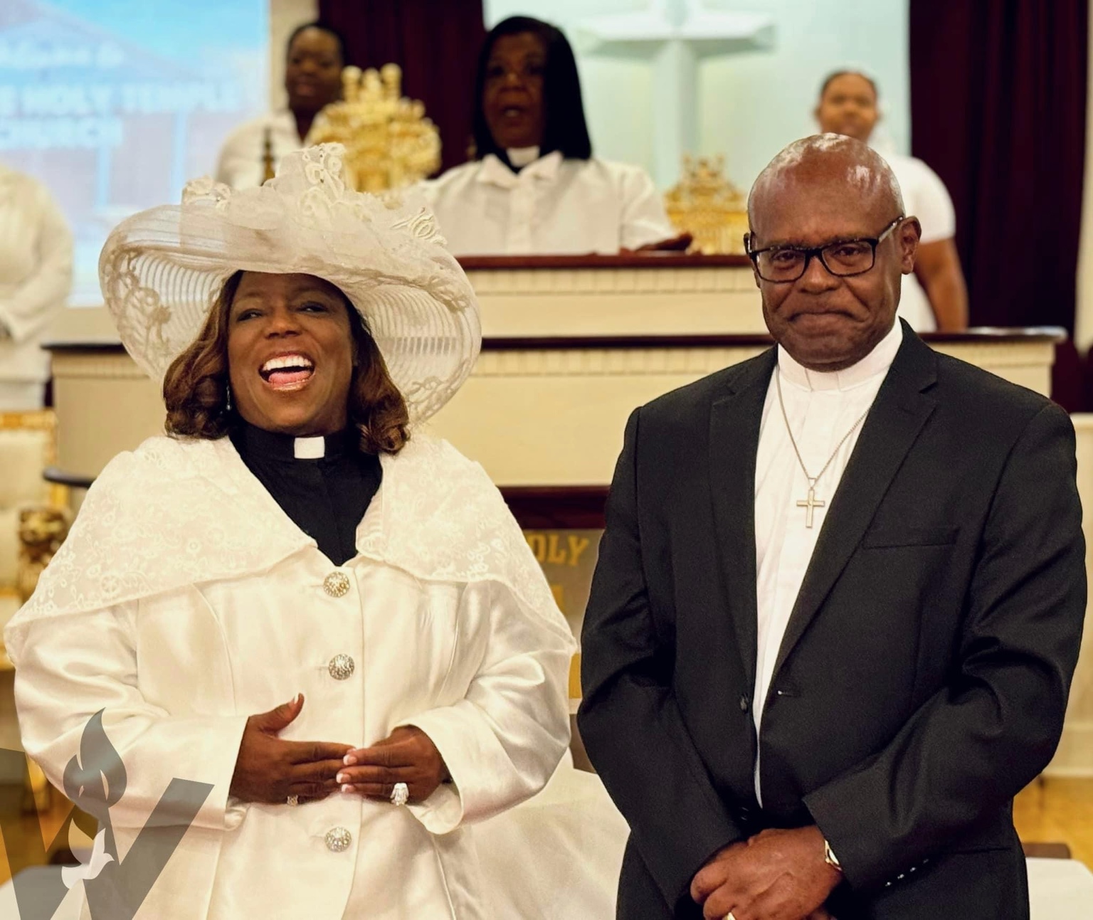 A joyful moment with Pastor Tony Hughes and Apostle Marion Hughes at Wayside Holy Temple Church